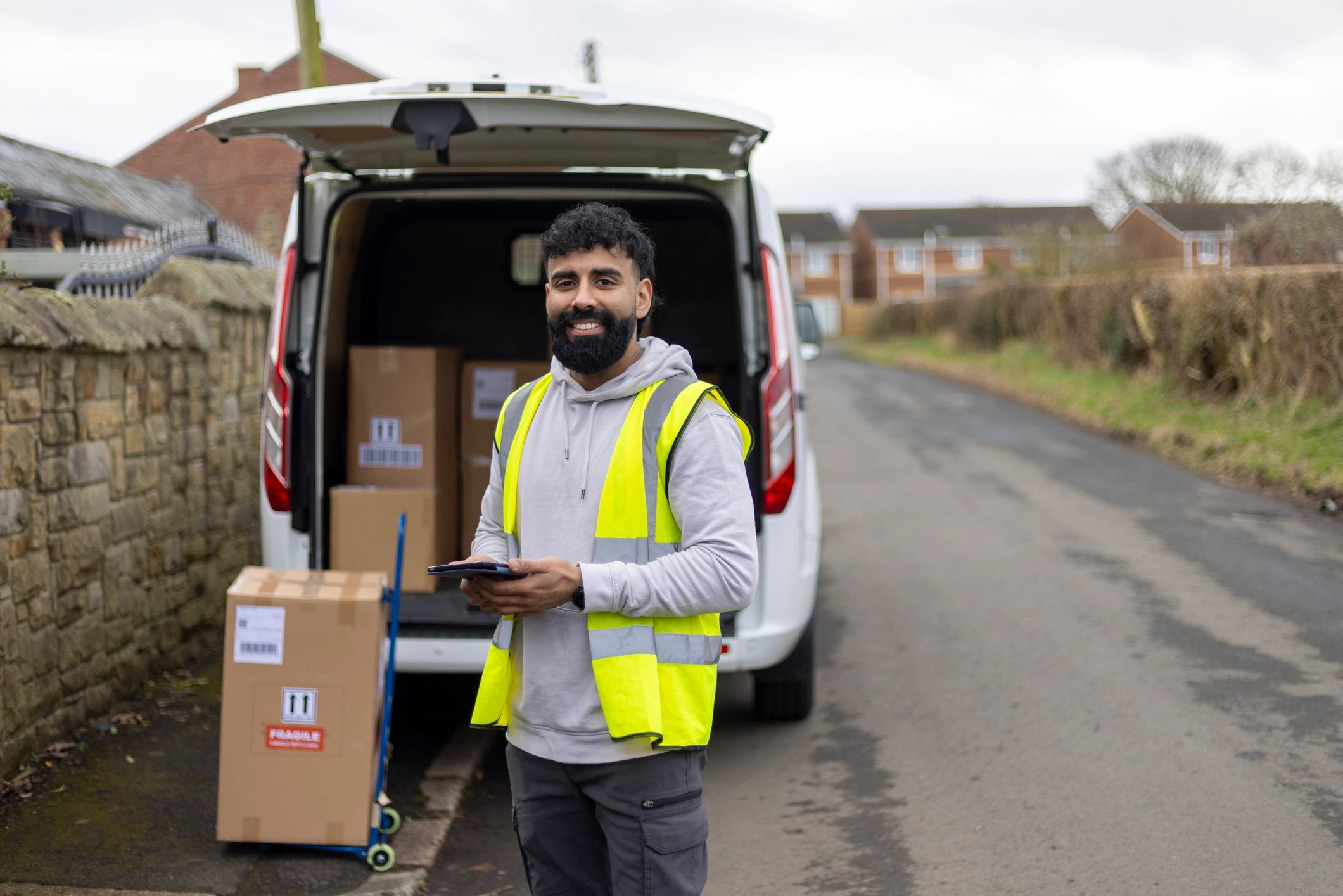 Delivery driver beside service van