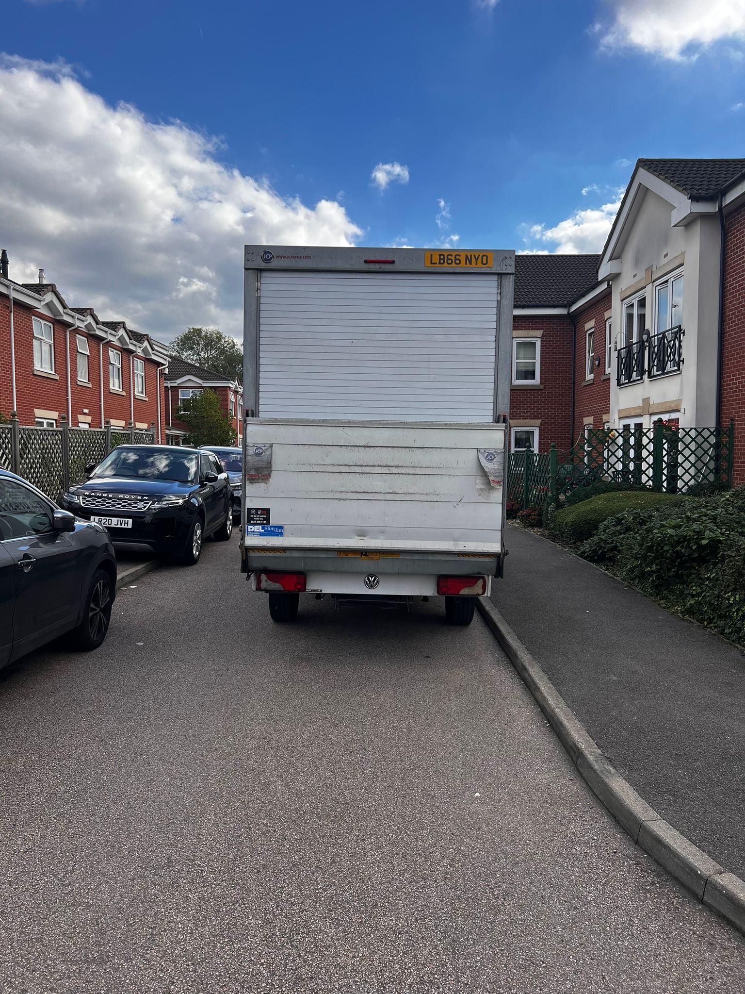 Rear view of FLEXI VAN removals truck parked on a residential street